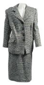 A lady's wool two piece suit by Hardy Aimes, Saville Row, London:, in a stylised tweed pattern,