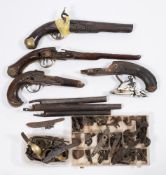 A collection of 18th century and later flintlock and percussion cap pistol fittings including parts