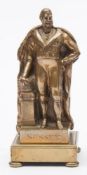 A gilt brass figure of the Duke of Sussex in robes, (brother to King George) 17cm high.