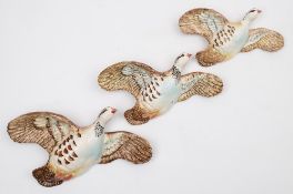 A graduated set of three Beswick pink legged partridge designed by Arthur Gredington:, (3).
