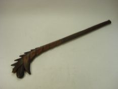 An Oceanic style hardwood club:, with scaled back and geometric carved handle, 96cm long.