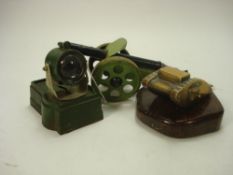 A tin-plate field gun by Burnett Limited England: together with an Astra diecast searchlight,