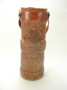 A George V red canvas shot/cordite bucket:, of traditional form with polychrome transfer armorial,