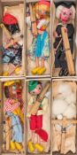 Pelham Puppets, a boxed group of six: 'Tyrolean' boy and girl, 'Poodle', 'Minstrel',