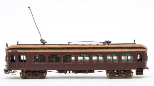 A Japanese brass OO/HO gauge brown painted powered tram car:, maker unknown.