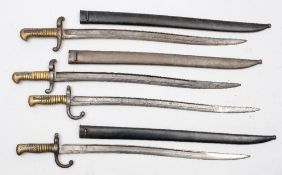 A group of four French 1870 pattern Gras bayonets:, three with steel scabbards, numbered '27075',