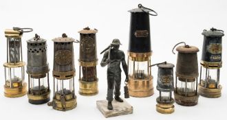A group of seven various miners lamps:, including two by F Thomas & William Ltd, Aberdeen,