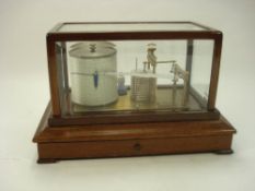 A lacquered brass and mahogany barograph by Casell, London:,