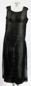An early 20th century black beadwork evening dress:,