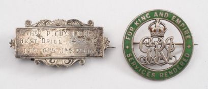 A George V green enamelled wound badge:, inscribed to the reverse ''Lce,