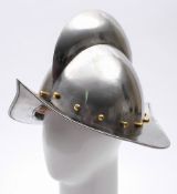 A reproduction Spanish morion helmet:, 20th century with broad comb, brass studs and a wide rim,