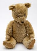 A 20th century blonde plush Teddy bear:, glass eyes,