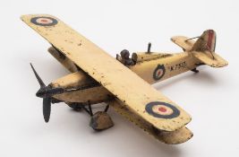 A cold painted bronze paperweight modelled as a Hawker Sydney biplane:,