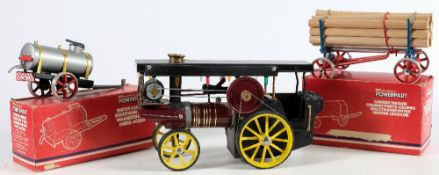 A Mamod live steam showman's traction engine:, black roof with lights,