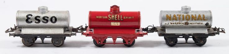 Hornby O gauge, a group of six petrol tank wagons:, ' Mobiloil', 'Shell Motor Spirit', 'National',