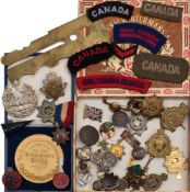 A collection of various cap and lapel badges:, including Le Regiment de Maisonneuve and others ,