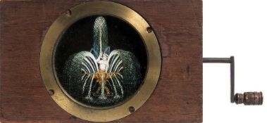 A 19th century three framed rackwork magic lantern slide of a water fountain by WE & F Newton,