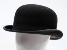 A black felt bowler hat by Lincoln Bennett & Co, London,: in original hat box.