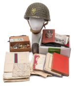 A collection of miscellaneous militaria:, including a 1979 British steel helmet,