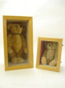 A mid 20th century blonde plush Teddy bear by Steiff:, with glass eyes, stitched nose and mouth ,