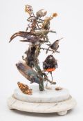 A Victorian taxidermy group of humming birds:, set on branches with another bird,
