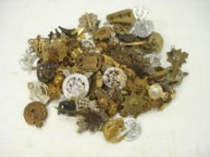 A collection of WWI, WWII and later cap badges:,
