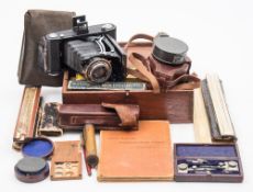 A lacquered brass 3 inch surveying compass by Newton & Co, London:, in a brown leather case,