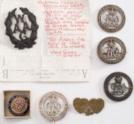 A WWII Woman's Army Auxiliary Corps cap badge: together with four GRV wound badges,