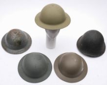 A group of five WWII and later steel helmets:. (5).