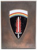 A bronze and enamel desk paperweight of the US Army in Europe shoulder badge:,