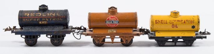 Hornby O gauge, a group of six petrol tank wagons:, ' Motor BP Spirit', 'Pratts', 'Redline',