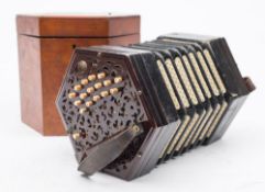 An early 20th century rosewood cased thirty-three key concertina by Lachenal & Co London:,