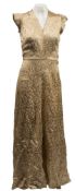 A mid 20th century gold cotton embroidered evening dress:, a pair of pink silk pyjama trousers,