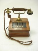 A Sterling Telephone & Electric Company brass and walnut desk intercom telephone:, with five lines,