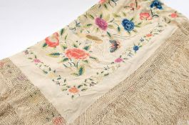 A 19th century lady's cream silk shawl with bird, inset and floral embroidery decoration:,