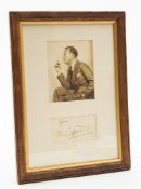 A framed autograph of Sir Noel Coward (1899-1973): mounted together with a facsimile,