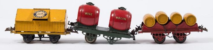 Hornby O gauge, a group of six goods wagons:, 'McAlpine & Sons' rotary tipping wagon and one other,