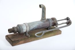A Danish bronze and brass boat pump by Wigo:, mounted on a wooden plinth,