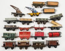 Hornby O gauge a group of goods wagons:, two crane trucks, a rotary tipping wagon,