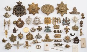 A collection of various British and Commonwealth cap and shoulder badges:,