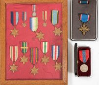 A framed group of WWII service medals and miniatures:, comprising 1939-45 Star and miniature,