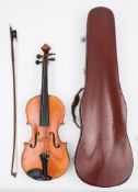 An early 20th century German student violin:, scroll carved headstock,