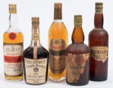 Four vintage bottles of whiskey and a bottle of brandy:, 'Ye Treasure Trove' Scotch,