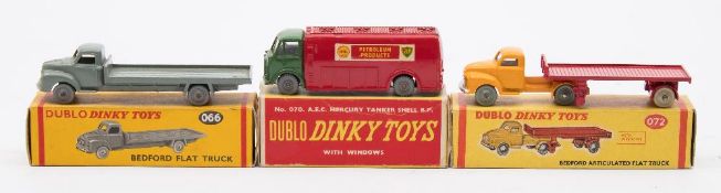 Dublo Dinky boxed group of three:, comprising No 066 Bedford Flat Truck, grey with grey wheels,