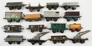 Hornby O gauge a group of goods wagons:, two crane trucks, a side tipping wagon,