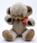 A Merrythought white plush Teddy bear:, with resin eyes, stitched nose and mouth and felt pads,