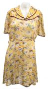 An early 20th century lady's blue cotton printed blouse:, a yellow cotton floral printed dress,