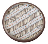 * David Leach (1911 - 2005) a stoneware plate: of shallow circular form decorated with alternating