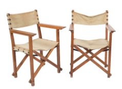 A pair of teak and canvas folding director-style chairs:, unsigned, reputedly from The Great Hall,