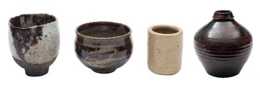A raku tea bowl, St Ives cylinder vase, small bowl and Tenmoku glazed globular vase.